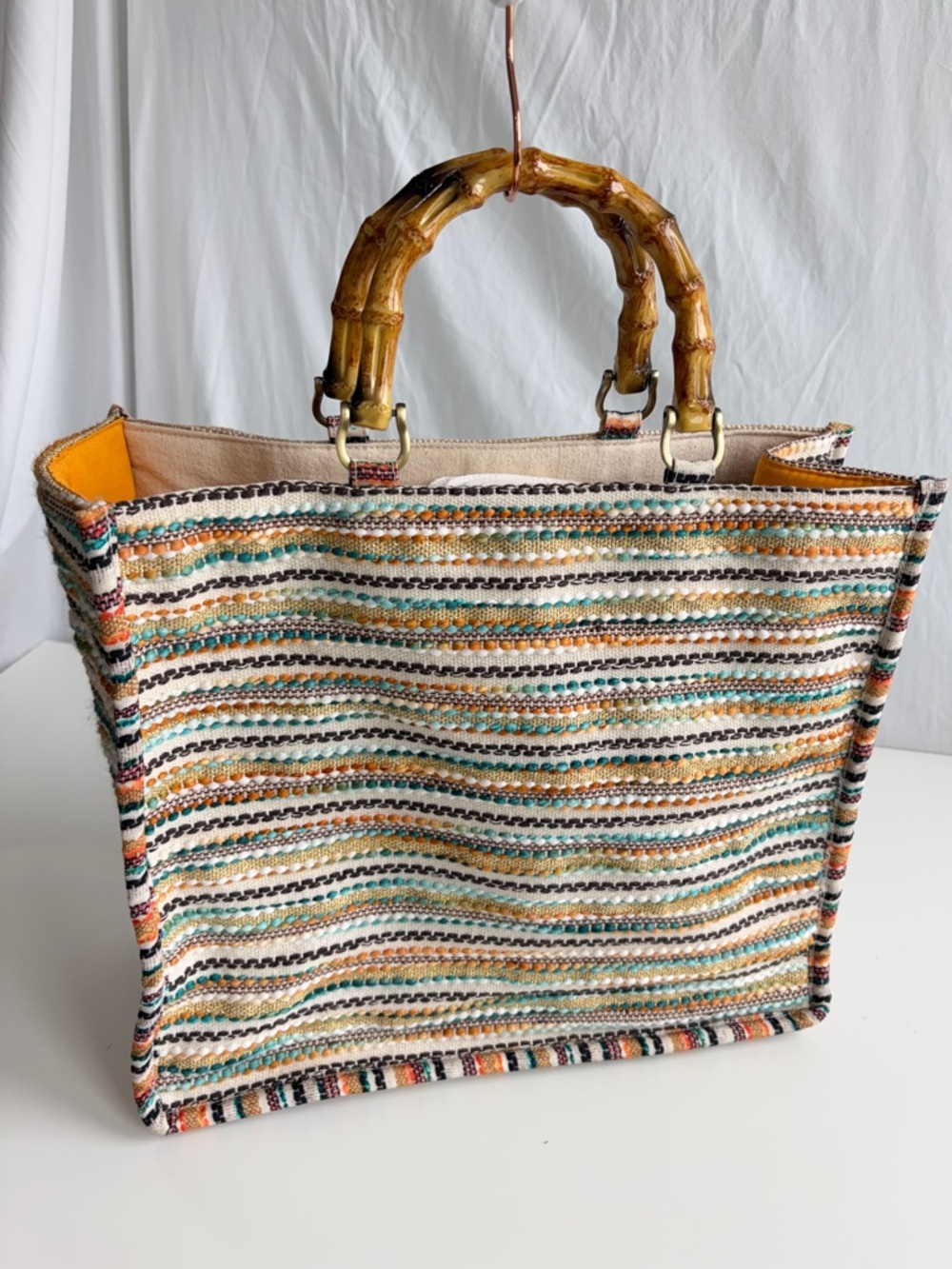 America & Beyond Luxe Leopard Tote Bag
Beaded Bamboo Handles Beige/Black/Orange - Picture 3 of 17